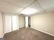 Neutral bedroom featuring neutral carpeting, walk-in closet, and a light neutral color on the walls at 5405 Lakeside Dr, Union City, GA 30291