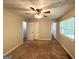 Bedroom with carpet floors, closet, a ceiling fan, and natural light at 5405 Lakeside Dr, Union City, GA 30291