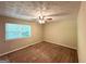 Bedroom with carpet floors, a ceiling fan, and natural light at 5405 Lakeside Dr, Union City, GA 30291