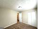 Bedroom with carpet floors, closet, and access to en-suite bathroom at 5405 Lakeside Dr, Union City, GA 30291