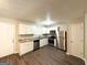 Kitchen featuring stainless steel appliances, white cabinets, granite counters and wood floors at 5405 Lakeside Dr, Union City, GA 30291