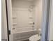 Bright bathroom showcasing a standard tub-shower combo and low-flow toilet for a clean, minimalist design at 1672 Fuma Leaf Way Rd, Mcdonough, GA 30253