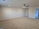 Spacious carpeted bedroom with ceiling fan and ample natural light at 1672 Fuma Leaf Way Rd, Mcdonough, GA 30253