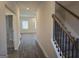 Hallway that leads to a living room and stairs at 1672 Fuma Leaf Way Rd, Mcdonough, GA 30253