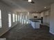 Bright and spacious living room with hardwood floors and large windows providing plenty of natural light at 1672 Fuma Leaf Way Rd, Mcdonough, GA 30253