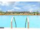 Resort-style pool area with lounge chairs under an inviting pergola, perfect for relaxation and entertainment at 1672 Fuma Leaf Way Rd, Mcdonough, GA 30253