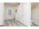 Welcoming entryway with wood-look floors and plenty of natural light at 307 Limestone Circle, Conyers, GA 30013
