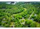 Scenic aerial shot of a property close to a golf course and a fishing/ski lake highlighting recreational opportunities at 7358 S Mitchell Ct, Villa Rica, GA 30180