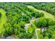 Overhead view of a property in a wooded area near a golf course, showcasing its location and community at 7358 S Mitchell Ct, Villa Rica, GA 30180