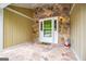 Inviting entrance area with stone floors, walls, and a white front door at 7358 S Mitchell Ct, Villa Rica, GA 30180
