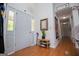 Welcoming foyer with hardwood floors, a shoe rack and coat rack at 7358 S Mitchell Ct, Villa Rica, GA 30180