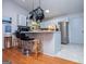 Modern kitchen featuring gray cabinets, stainless steel appliances, and breakfast bar at 7358 S Mitchell Ct, Villa Rica, GA 30180
