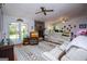 Bright living room featuring a stone fireplace and cozy seating at 7358 S Mitchell Ct, Villa Rica, GA 30180