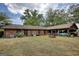 Brick home featuring a large backyard and a covered carport with parking at 1024 Bethany Rd, Covington, GA 30016