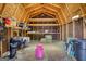 A-frame barn interior, showing storage shelves, hay bales and horse equipment at 1024 Bethany Rd, Covington, GA 30016