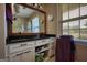 Bathroom vanity with large mirror, granite countertop, and ample storage at 1024 Bethany Rd, Covington, GA 30016