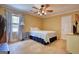 Bedroom featuring a ceiling fan, natural light, and neutral color scheme at 1024 Bethany Rd, Covington, GA 30016