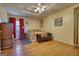 Bedroom featuring hardwood floors, coffered ceiling, and upholstered bench at 1024 Bethany Rd, Covington, GA 30016