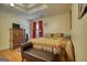 Bedroom with hardwood floors, coffered ceiling, and flat-screen television at 1024 Bethany Rd, Covington, GA 30016