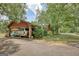 Carport with covered parking for two cars near the house at 1024 Bethany Rd, Covington, GA 30016
