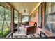 Relaxing front porch area furnished with comfortable wicker seating, swing and a view of the yard at 1024 Bethany Rd, Covington, GA 30016
