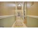 Bright hallway with carpet runner and neutral paint at 1024 Bethany Rd, Covington, GA 30016