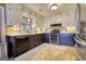 Well-lit kitchen featuring tile countertops, a double oven, and plenty of storage at 1024 Bethany Rd, Covington, GA 30016