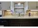 Kitchen featuring a white sink with dark brown cabinets underneath at 1024 Bethany Rd, Covington, GA 30016