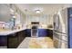 Updated kitchen with stainless steel appliances and ample cabinet space with contrasting colors at 1024 Bethany Rd, Covington, GA 30016