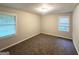 Cozy bedroom with plush carpeting, natural light, and neutral wall paint at 51 Springside Se Dr, Atlanta, GA 30354