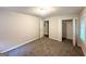 Spacious bedroom featuring plush carpeting, neutral paint, and closet with shelving at 51 Springside Se Dr, Atlanta, GA 30354