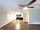 Spacious living room with wood flooring, recessed lighting, and large windows for ample natural light at 51 Springside Se Dr, Atlanta, GA 30354