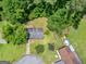 Aerial view displays the home's well-maintained yard, mature trees, and a patio area at 1356 Lori Ct, Conley, GA 30288