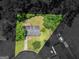 Aerial shot highlighting the home's landscaped yard, mature trees, and outdoor spaces at 1356 Lori Ct, Conley, GA 30288