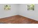 This is a bedroom with natural light and hardwood floors at 1356 Lori Ct, Conley, GA 30288