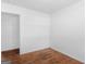 Simple bedroom with wood floors and a door to another room at 1356 Lori Ct, Conley, GA 30288