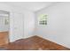 This bedroom offers a large closet and a window at 1356 Lori Ct, Conley, GA 30288