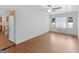 Open-concept living space with wood floors, ceiling fan, and natural light at 1356 Lori Ct, Conley, GA 30288