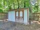A backyard shed with double doors offers secure storage and complements the yard at 1356 Lori Ct, Conley, GA 30288