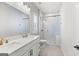Bathroom boasts double sinks, modern fixtures, and a walk-in glass shower at 229 Widener Way, Peachtree City, GA 30269