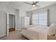 Cozy bedroom with a ceiling fan, white shutters, and a closet at 229 Widener Way, Peachtree City, GA 30269
