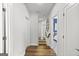 Hallway view featuring hardwood floors and a view of the staircase at 229 Widener Way, Peachtree City, GA 30269