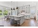 Spacious kitchen featuring gray cabinets, center island with seating and stainless steel appliances at 229 Widener Way, Peachtree City, GA 30269