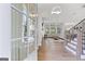 Bright, open living space with hardwood floors, large windows and contemporary lighting fixtures at 229 Widener Way, Peachtree City, GA 30269