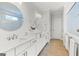 Spacious main bathroom with a double vanity and view into shower and toilet room at 229 Widener Way, Peachtree City, GA 30269