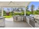 Outdoor kitchen with stainless steel appliances, perfect for entertaining with yard views at 229 Widener Way, Peachtree City, GA 30269