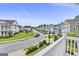 Street view showcases well-maintained homes, green lawns, and a neatly paved road at 229 Widener Way, Peachtree City, GA 30269
