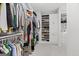 Well-organized walk-in closet with custom shelving and storage solutions for an extensive wardrobe at 229 Widener Way, Peachtree City, GA 30269