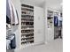 Organized walk-in closet featuring custom shelving and storage for clothing, shoes and accessories at 229 Widener Way, Peachtree City, GA 30269