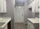 Functional kitchen with white cabinets, a back door, and vinyl flooring at 2914 Parc Lorraine, Lithonia, GA 30038
